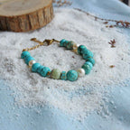 Braccialetto con Turchese e pietre varie, perle coltivate, acciaio oro