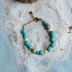 Braccialetto con Turchese e pietre varie, perle coltivate, acciaio oro